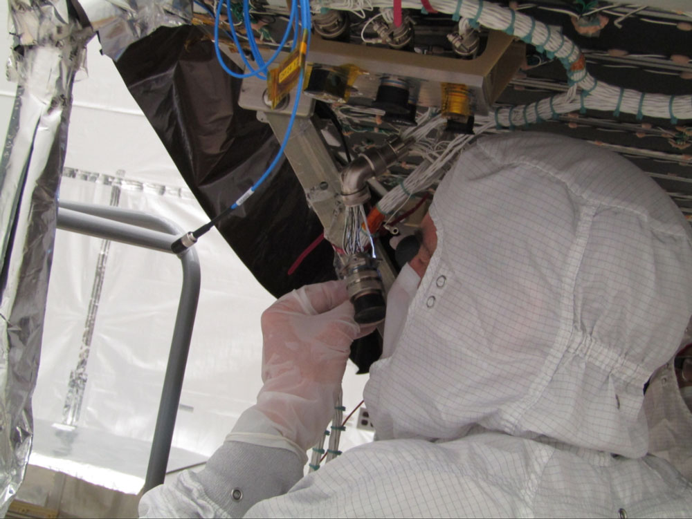 Technician Chris Haag works on a connector in the GOES-T ABI radiator at the L3Harris facility in Rochester, New York. Credit: L3Harris