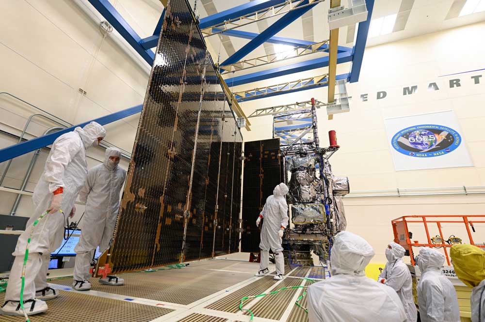 Engineers conduct the GOES-T solar array deployment test. Credit: Lockheed Martin