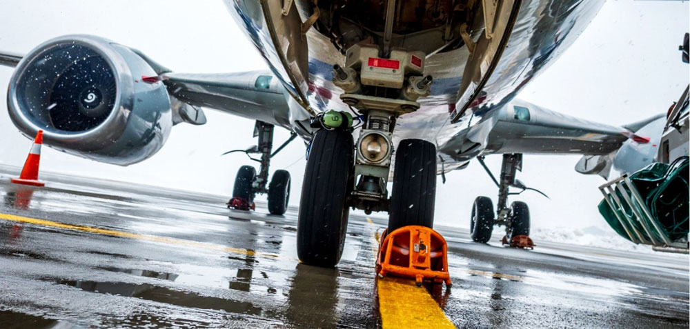 A passenger aircraft undergoes maintenance in preparation for flight