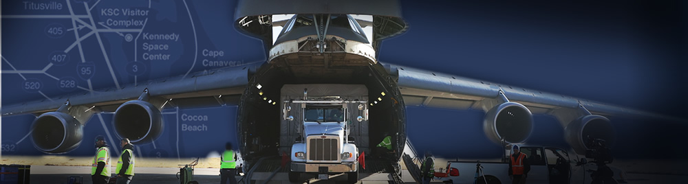  GOES-T arrives at Kennedy Space Center - image of crated spacecraft being off loaded from large transport plane.